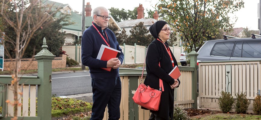 Community Visitors in the front garden of a house