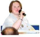 Woman talking into a microphone