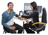 Female doctor checking the blood pressure of a male patient