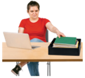 woman sitting at desk with computer and in-tray of papers